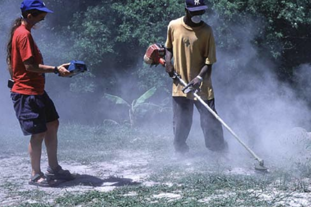 An image of people wearing masks to protect themselves from dust.