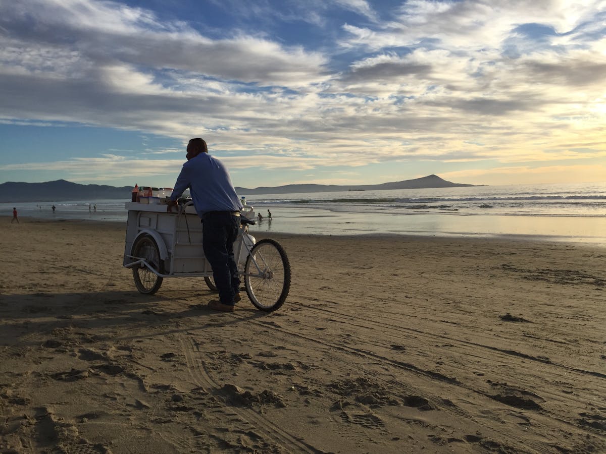 A taco cart rolling through the beach at Ensenada, Baja California